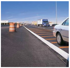 Orange rumble strips on the approach to a work zone.